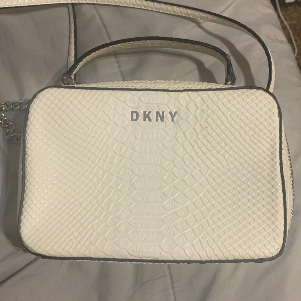 tiny white dkny bag has removable straps :)